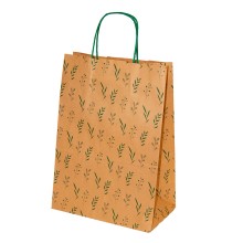 Bolsa de papel impresa con un estampado de hojas en color verde con asa retorcida o rizada